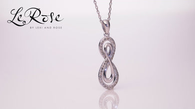 .925 Sterling Silver 1/6 Cttw Diamond Double Infinity 1-1/8