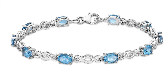 .925 Sterling Silver, Oval Cut Lab Grown Blue Topaz & Lab Grown White Sapphire Alternating Stone and Twist Link Tennis Bracelet - 7-1/4"