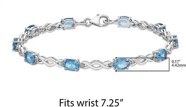 .925 Sterling Silver, Oval Cut Lab Grown Blue Topaz & Lab Grown White Sapphire Alternating Stone and Twist Link Tennis Bracelet - 7-1/4